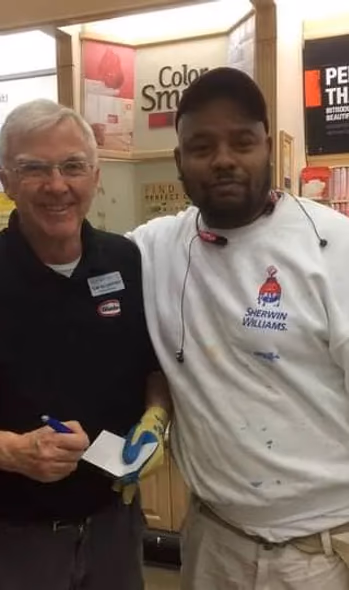 Tom the painter next to a another man