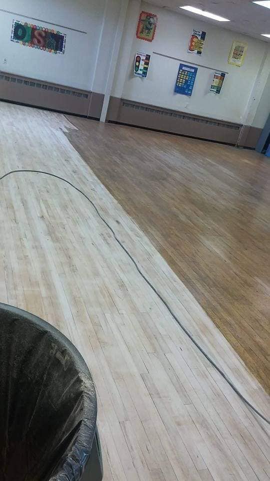 wooden floor being stained